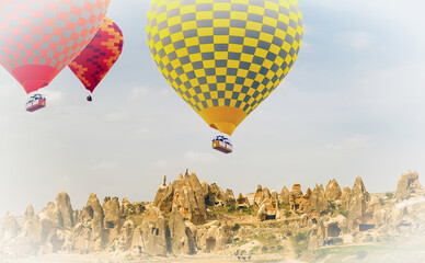 Hot air balloon flying over Mountain landscape Cappadocia Turkey.