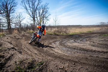 Motocross rider entering a corner.