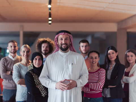 Portrait Of Multiracial Diverse Group Of Businesspeople Team Standing Behind Older Arab Team Leader 