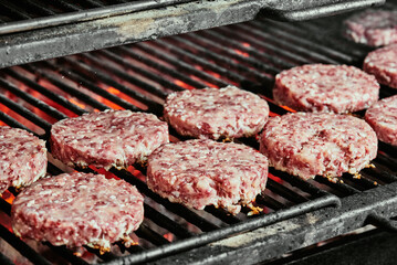 raw burger cutlets - cutlets made from organic beef on a grill. raw cutlets. 