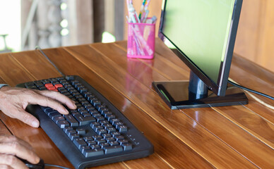 A close up of a man working on a computer