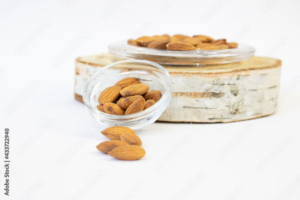 Sticker Closeup shot of almonds isolated on white backgroun