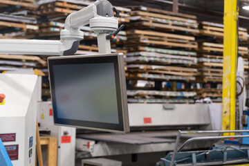 Touch Screen attached to computerised machinery in a factory