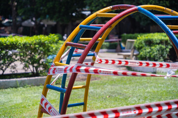Park kids and children playground for game and activity empty and closed for Coronavirus or Covid19. And strips with word "not allowed area" in Vietnam
