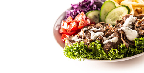 Savory Turkish veal kebab served with fresh vegetables, letuce, french fires and lovely and delicious dip, mayonnaise
