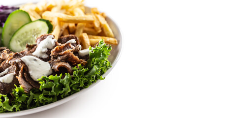 Savory Turkish veal kebab served with fresh vegetables, letuce, french fires and lovely and delicious dip, mayonnaise