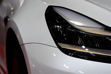 closeup detail on one of the LED headlights modern car
