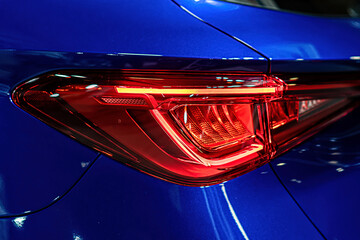 closeup of a red taillight on a modern car, detail on the rear light of a car