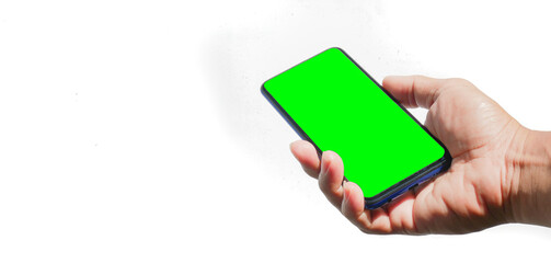 Hand holding a mobile phone with a green screen blank For adding various contents