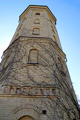 A brick water tower built in 1904 at the former textile factory, also known as the pressure tower at Augustowska Street in the city of Białystok in Podlasie, Poland.