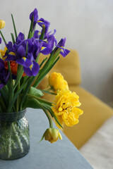 Lush bouquet with yellow tulips and irises