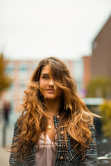 Woman on street. Focus is on woman.