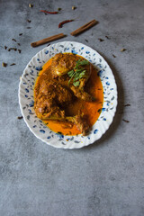 Popular Indian mughal dish chicken chap prepared with big pieces of chicken meat in rich spicy gravy. A popular item of the mughal cuisine. Top view.