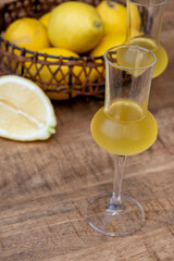 Glasses of cold sweet italian strong alcoholic liquor limoncello made from fresh lemons.