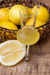 Fototapeta premium Glasses of cold sweet italian strong alcoholic liquor limoncello made from fresh lemons.