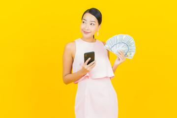 Portrait beautiful young asian woman smile with a lot of cash and money