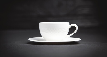Coffee cup on the black background.