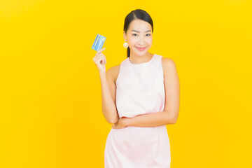 Portrait beautiful young asian woman smile with credit card