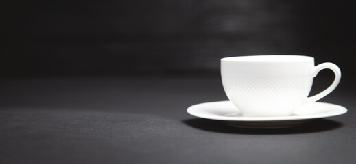 Coffee cup on the black background.