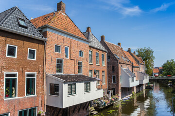 Fototapeta na wymiar Wooden hanging kitchens on historic houses in Appingedam, Netherlands