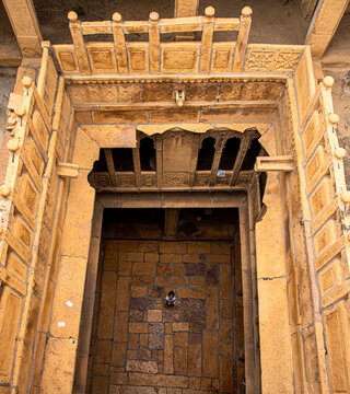 a boy is standing in the middle of haweli in rajasthan.