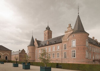 Hoeselt, Limburg - Belgium - 13.05.2021. Old castle Alden Biesen. Orange trees in flower beds .Spring time