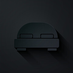 Paper cut Big bed for two or one person icon isolated on black background. Paper art style. Vector