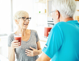 man woman couple senior healthy food breakfast retirement juice exercise training sport fitness break happy