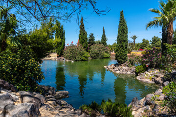 Obraz premium Beautiful lake in the center of the city in the Parque de las Naciones in the town of Torrevieja, Alicante, Mediterranean Sea. Spain