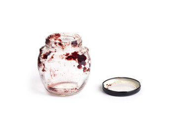Empty jam jar on a white background