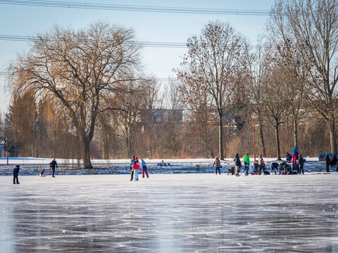 Wintertime Fun on a frozen pond in Zoetermeer, the Netherlands