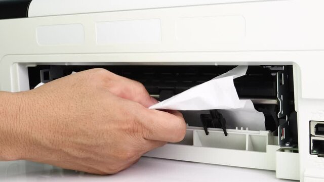 Technicians Removing Paper Stuck, Paper Jam In Printer At Office