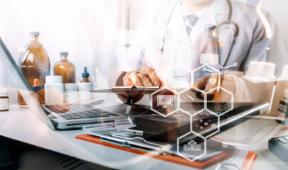 Male doctor sitting at table and writing on a document report in hospital office. Medical healthcare staff and doctor service.