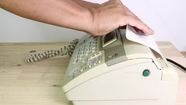 hand man are using a fax machine in the office, equipment for data transmission.