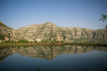 Obraz premium reflection of the mountain lake in the mountain
