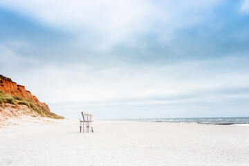 Beach - chairs on the island Sylt. Germany.  Summer cloudy weather. - obrazy, fototapety, plakaty