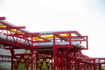 Steel pipelines, valves and ladders in an industrial enterprise