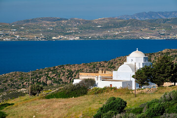 Fototapeta na wymiar View of Milos island and Greek Orthodox traditional whitewashed church in Greece