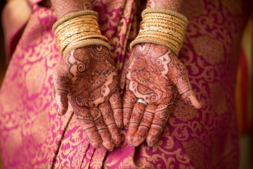 Female hands showing henna tattoos