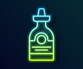 Fototapeta premium Glowing neon line Tequila bottle icon isolated on black background. Mexican alcohol drink. Vector