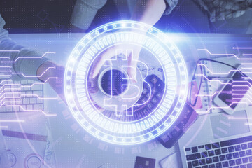 Double exposure of man and woman working together and crypto theme hologram drawing. Computer background. Blockchain concept. Top View.