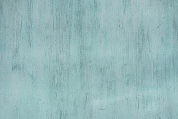 Painted in green old cracked metal rusted background. Metal texture. Erosion metal. Scratched and dirty texture on outdoor metal wall.