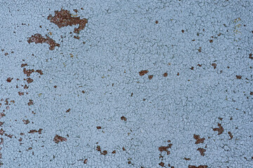 Painted in white old cracked metal rusted background. Metal rust texture. Erosion metal. Scratched and dirty texture on outdoor rusted metal wall.