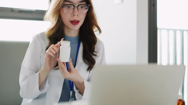Woman doctor visit,telemedicine healthcare concept,young female doctor giving advice over laptop computer .she using laptop to get medical consultation online and explane .