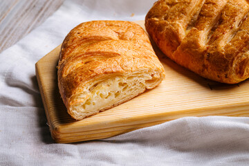 Closeup on fresh baked puffs with cheese filling