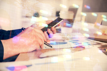 Multi exposure of man's hands holding and using a digital device and data theme drawing. Innovation concept.