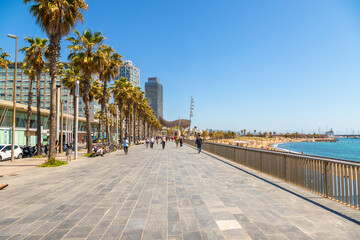 Picture of Barceloneta seafront promenade captured during a sunny day.