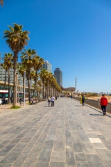 Picture of Barceloneta seafront promenade captured during a sunny day. © Maxim Morales