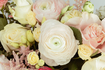 Flower statuette composed of minirosa, ranunculus, eustoma, matiola, astilbe, roses and eucalyptus.