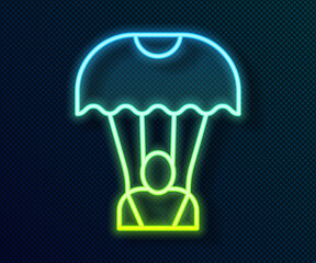 Glowing neon line Parachute icon isolated on black background. Vector